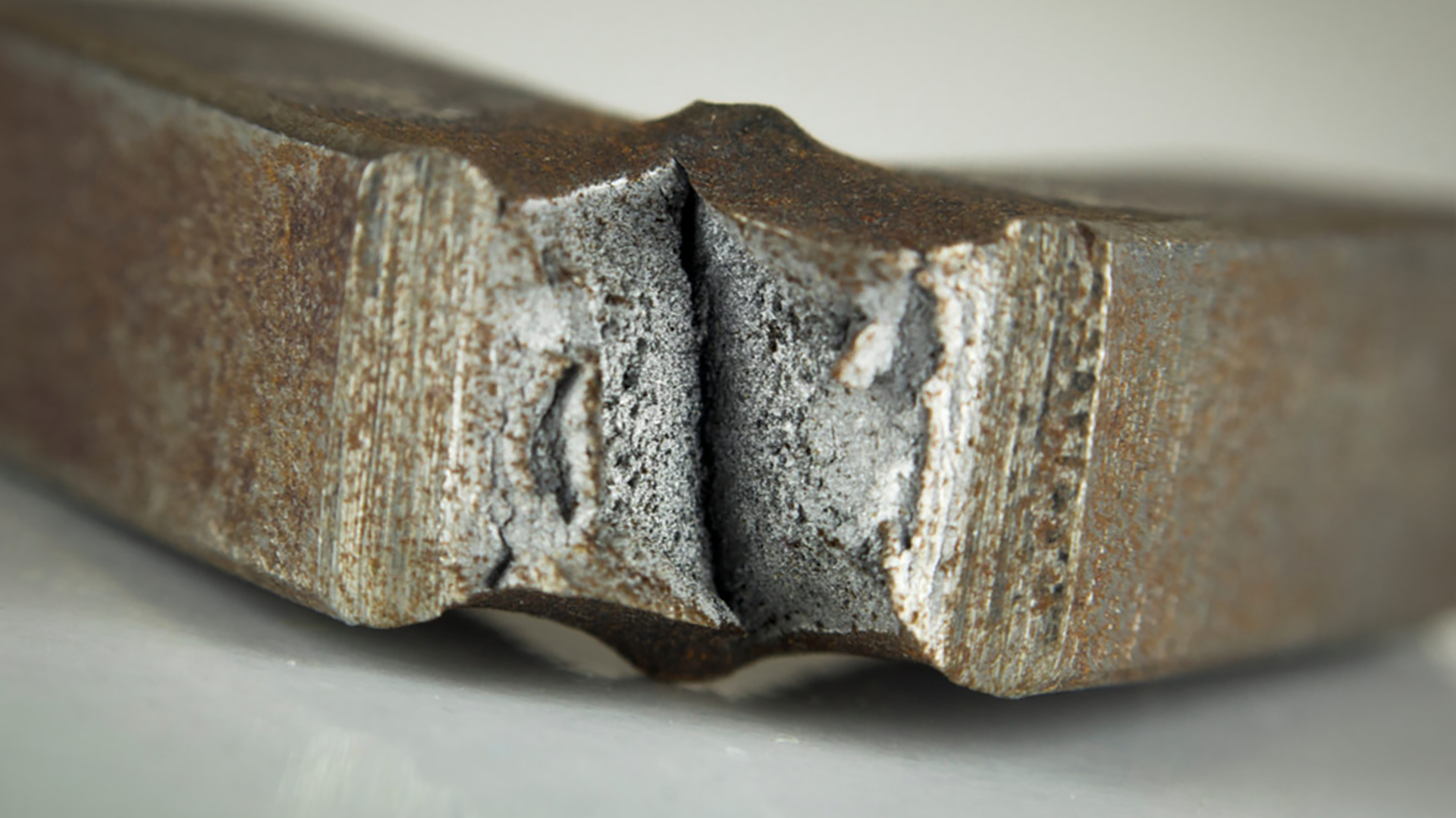 Tested material sample from pendulum impact system
