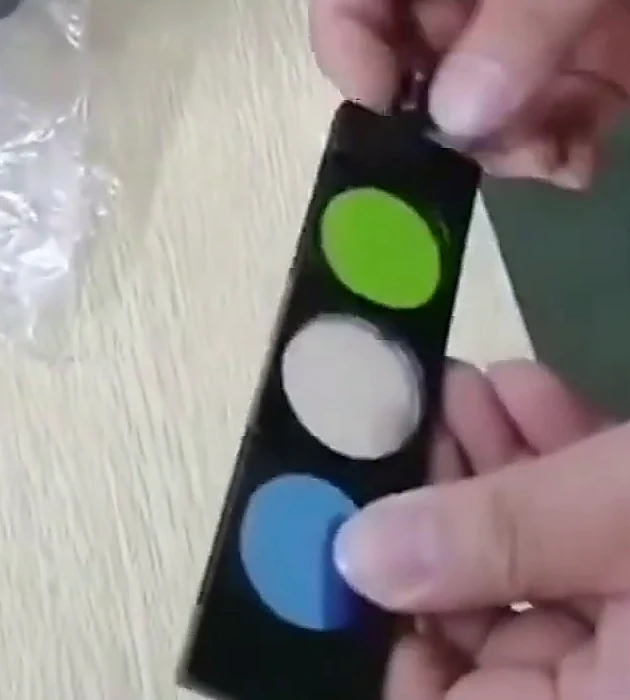 Colour filter holder supplied with the G-800E, showing three filters in the carrier