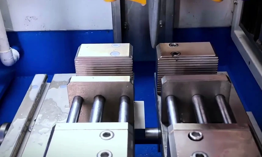 Clamping blocks mounted on the T-slot XY table of the GenCut GL 120XY